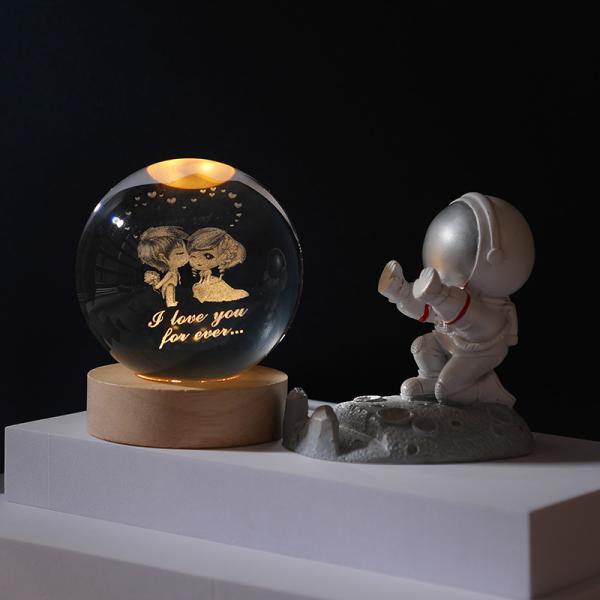 Glass globes with illuminated base. Multiple designs to suit different tastes.
