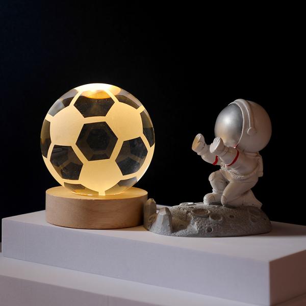 Glass globes with illuminated base. Multiple designs to suit different tastes.