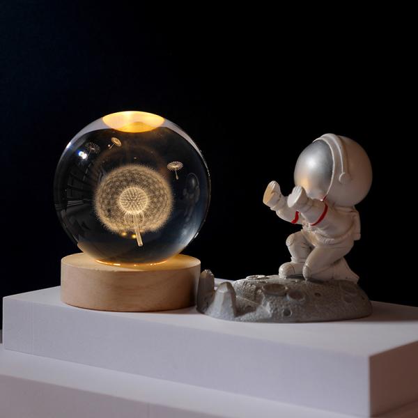 Glass globes with illuminated base. Multiple designs to suit different tastes.