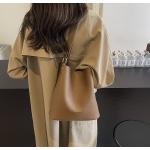 Bucket bags with a wallet are designed in a modern style that combines practicality and elegance. The bags feature a top drawstring design for easy closure.