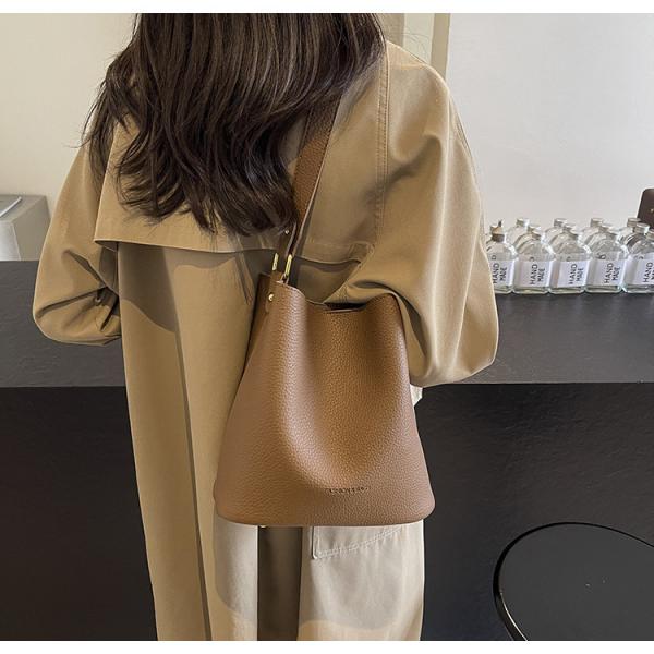 Bucket bags with a wallet are designed in a modern style that combines practicality and elegance. The bags feature a top drawstring design for easy closure.