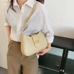 elegant handbag in four multi-colored colors. A luxurious touch to every look. Elevate your elegance with this classic bag, carefully designed to combine simplicity and elegance